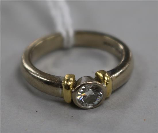 An 18ct gold and collet set solitaire diamond ring, size K.